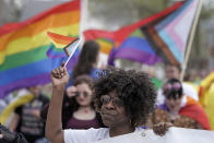 Teresa Parks walks in the Little Apple Pride parade Saturday, April 23, 2022, in Manhattan, Kan. Inspired by protests following the death of George Floyd, parks co-founded a Black Lives Matter group and as part of a task force has pushed for more inclusion for people from diverse backgrounds in the predominantly white community. (AP Photo/Charlie Riedel)