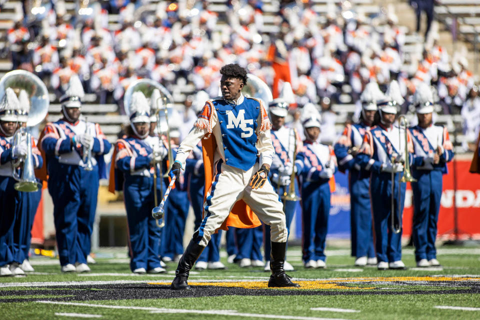 The Morgan State University marching band performs on the field in blue and white costumes (American Honda)