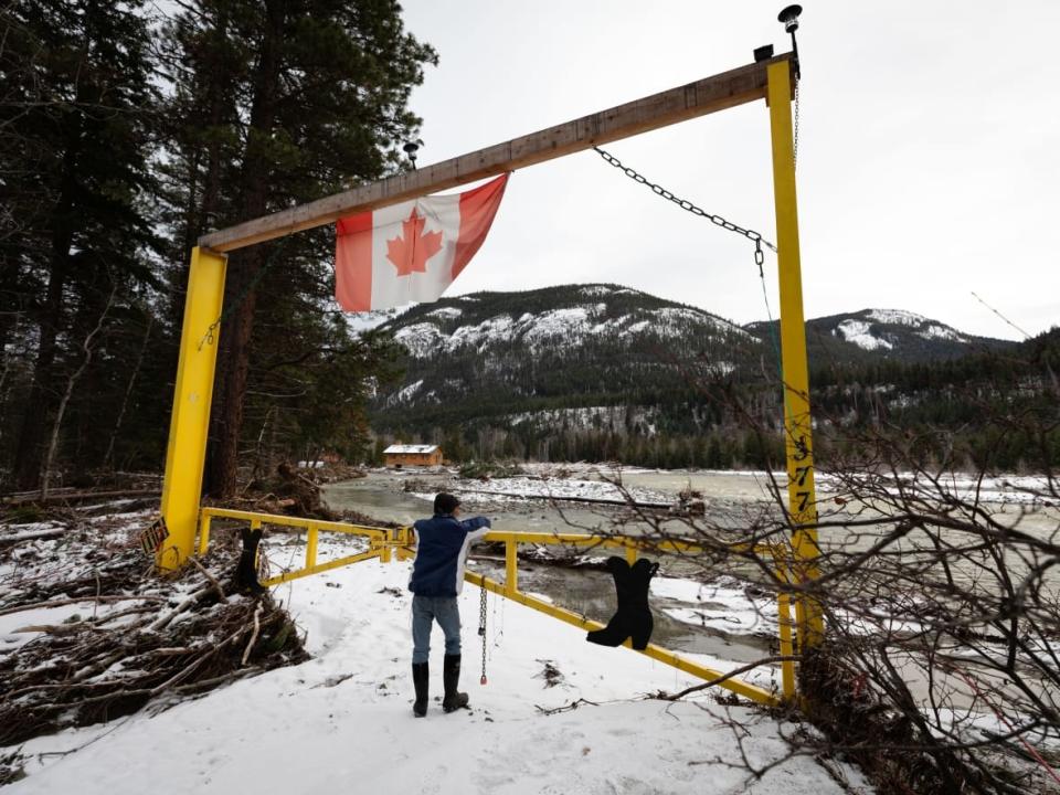 The entrance to a property that was washed away during a flood is pictured in Tulameen, B.C. An incoming cold front will see snow accumulate in many flood-affected areas in the south of the province. (Maggie MacPherson/CBC - image credit)