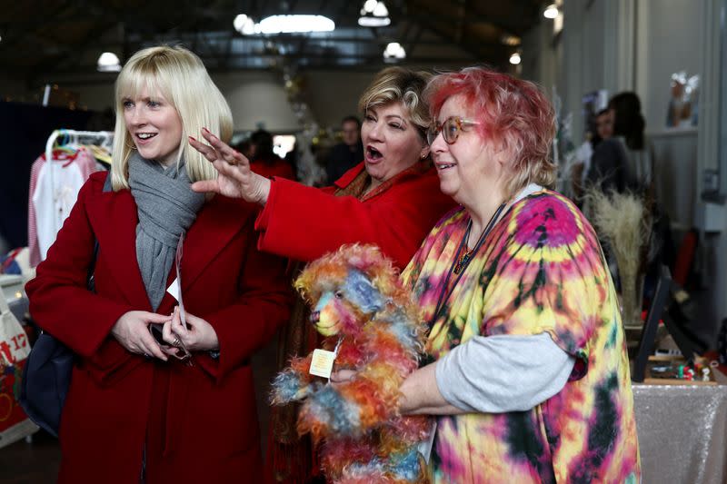 Rosie Duffield and Emily Thornberry speak to a stall holder at an Etsy market in Canterbury