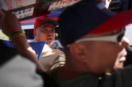 Opposing protesters argue during demonstrations on the campus of University of Nevada, Las Vegas, before for the last 2016 U.S. presidential debate in Las Vegas, Nevada, U.S., October 19, 2016. REUTERS/Jim Urquhart