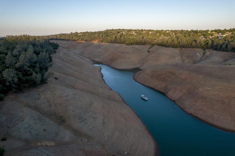 <div class="inline-image__title">1233610870</div> <div class="inline-image__caption"><p>"Steep banks surround a boat as it travels on Oroville Lake during low water levels in Oroville, California, U.S., on Tuesday, June 22, 2021. Almost three-fourths of the western U.S. is gripped by drought so severe that its off the charts of anything recorded in the 20-year history of the U.S. Drought Monitor. Photographer: Kyle Grillot/Bloomberg via Getty Images"</p></div> <div class="inline-image__credit">Bloomberg</div>