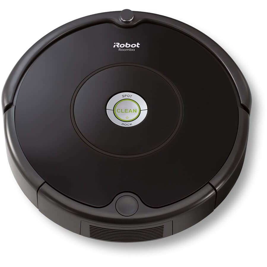 A round black iRobot vacuum sits on a white background.