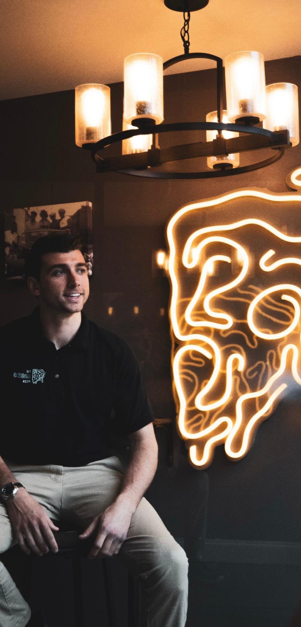 Angelo Pizza, owner of The Angelo Pizza in Philadelphia, sits inside his Old City shop which opened in 2020.