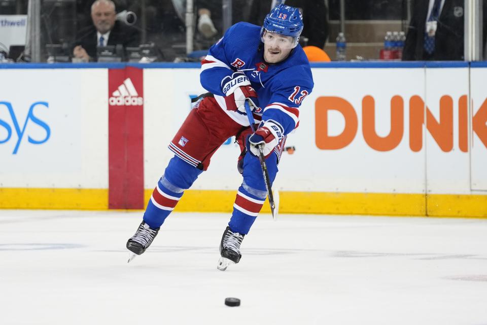 New York Rangers' Alexis Lafreniere passes to a teammate during the first period of an NHL hockey game against the Minnesota Wild, Thursday, Nov. 9, 2023, in New York. (AP Photo/Frank Franklin II)