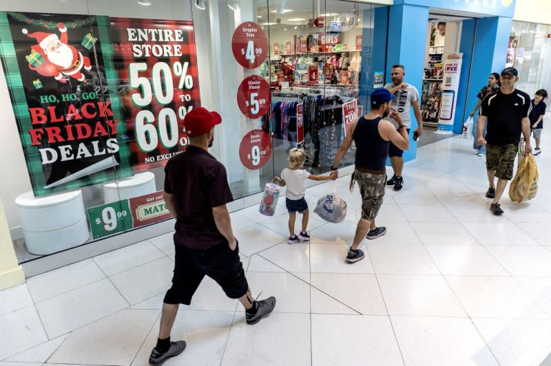 Shoppers look for Black Friday deals while shopping at the Dolphin Mall in Miami, Fla., on Thursday. Photo by Cristobal Herrera-Ulashkevich/EPA-EFE