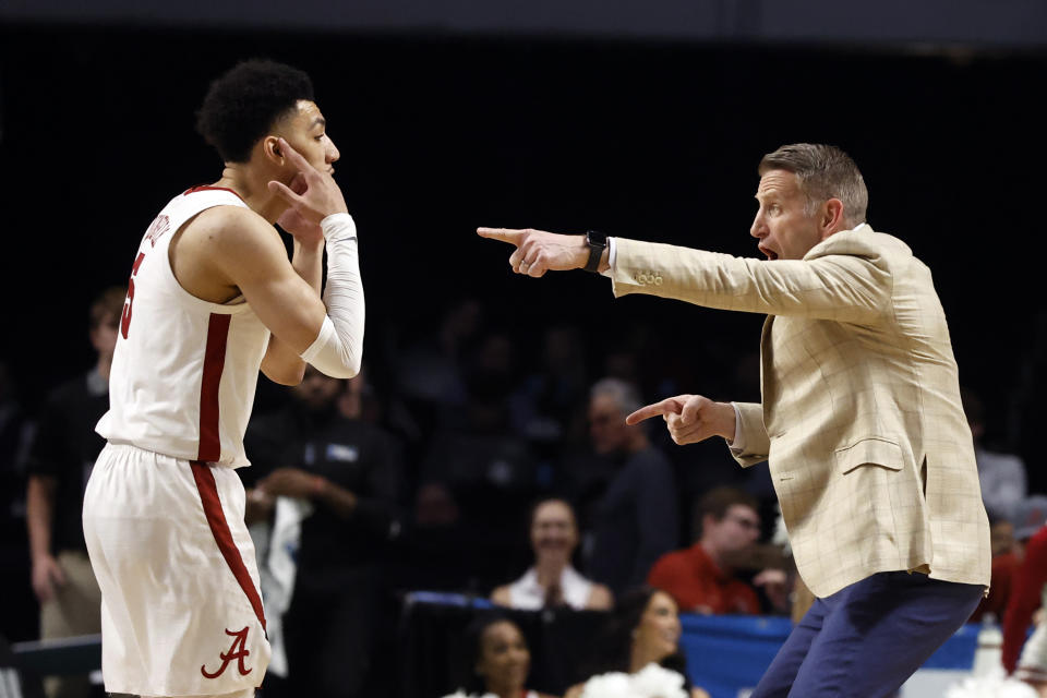 Alabama head coach Nate Oats, right, directs guard Jahvon Quinerly (5) in the first half of a first-round college basketball game against Texas A&M Corpus Christi in the NCAA Tournament in Birmingham, Ala., Thursday, March 16, 2023. (AP Photo/Butch Dill)