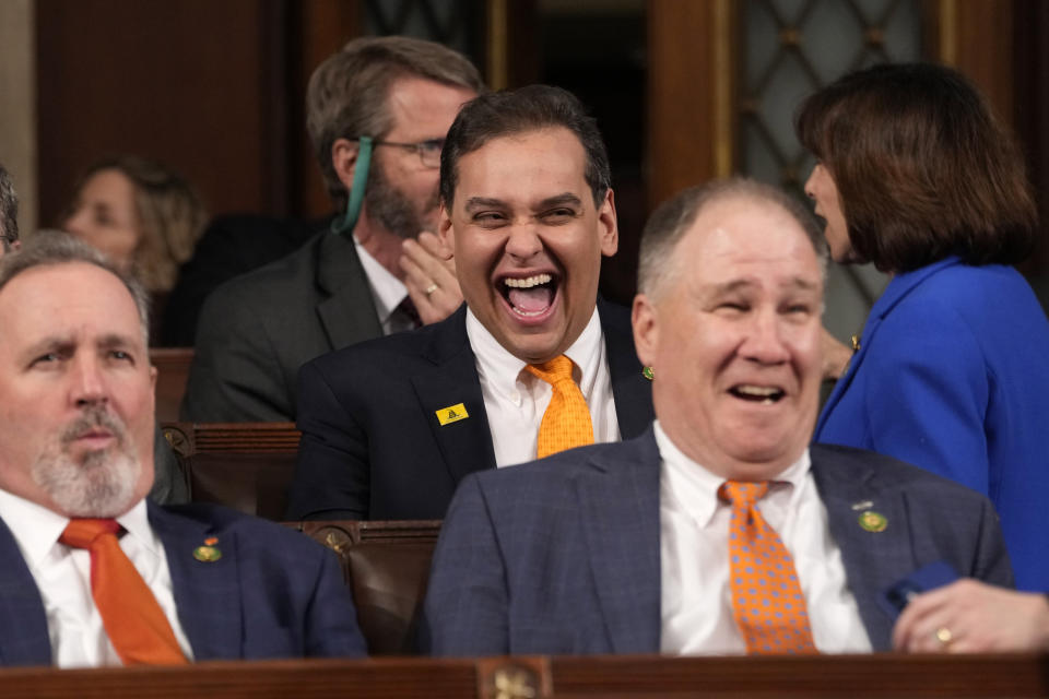 FILE - Rep. George Santos, R-N.Y., laughs before President Joe Biden delivers the State of the Union address to a joint session of Congress at the U.S. Capitol, Feb. 7, 2023, in Washington.Santos is carrying on in Congress despite calls for him to resign. Santos admitted to fabricating many aspects of his life story, but the newly elected congressman is refusing calls to quit. (AP Photo/Jacquelyn Martin, Pool, File)