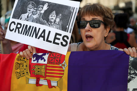 Protesters in favor of the Socialist's government's plans to exhume the remains of former dictator Francisco Franco from the giant mausoleum at "The Valley of the Fallen", gather outside parliament before the vote in Madrid, Spain, September 13, 2018. REUTERS/Susana Vera