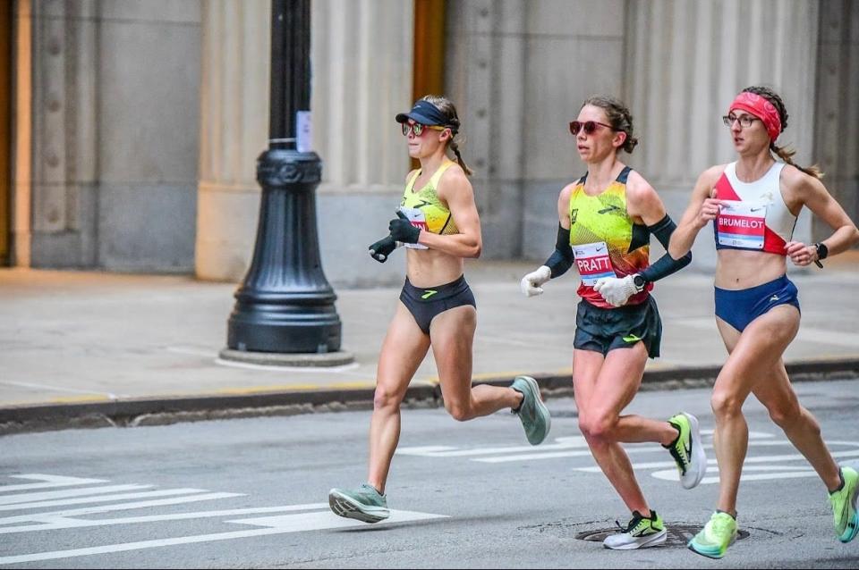 Jessie Cardin, left, teammate Olivia Pratt and France's Marie-Ange Brumelot keep pace through the streets of Chicago.