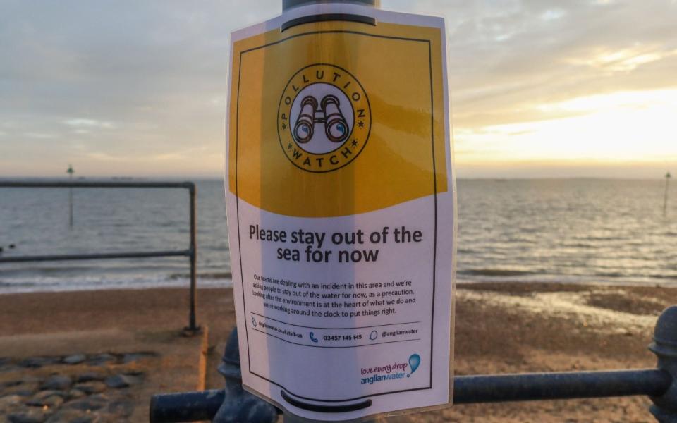 Warning signs along the seafront in Southend-on-Sea, Essex, advising people not to enter the water following a sewage leak - Shutterstock