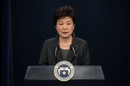 FILE PHOTO - South Korean President Park Geun-Hye speaks during an address to the nation, at the presidential Blue House in Seoul November 4, 2016. REUTERS/Ed Jones/Pool/File Photo