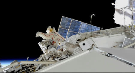 Russian cosmonauts Oleg Kononenko and Sergey Prokopyev conduct a spacewalk outside the International Space Station Space (ISS) in this still image captured from NASA video in space, December 11, 2018. Courtesy NASA TV/Handout via REUTERS