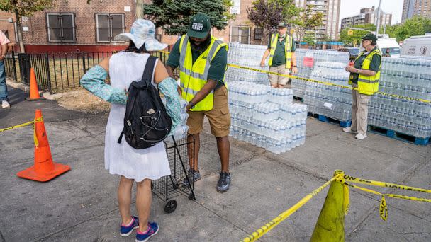 PHOTO: Residents of NYCHA Jacob Riis Houses were seen filling bottles from NYC DEP water stations or collecting bottled water at Avenue D and East 10th Street in New York, on Sept. 4, 2022. (Theodore Parisienne/New York Daily News via TNS via Newscom)