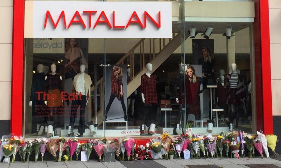 Floral tributes outside the Matalan store in Queen Street, Cardiff.