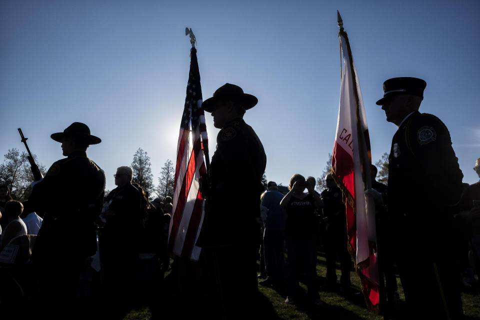 An honor guard prepares to present the colors during the dedication of the Borderline Healing Garden at Conejo Creek Park in Thousand Oaks, Calif., Thursday, Nov. 7, 2019. The dedication marked the anniversary of a fatal mass shooting at a country-western bar a year earlier. (Hans Gutknecht/The Orange County Register via AP)