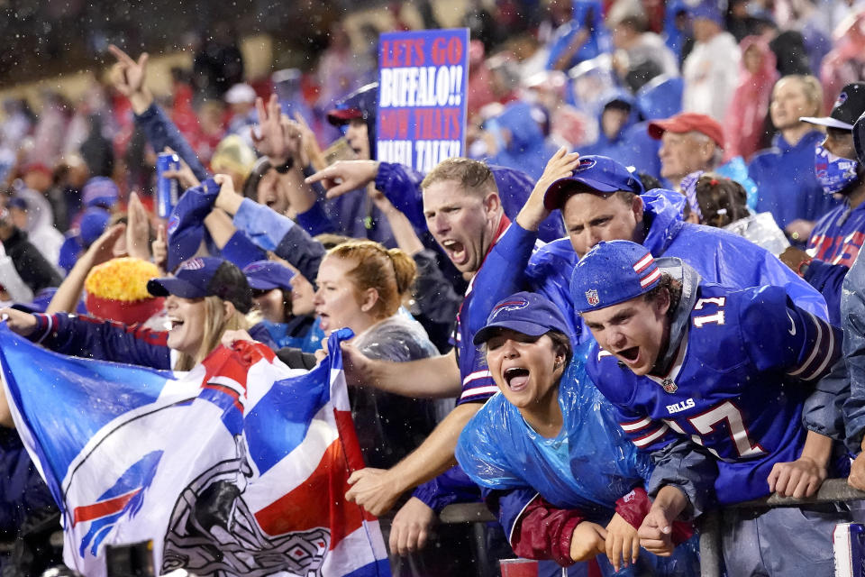 Buffalo Bills fans celebrate late in an NFL football game against the Kansas City Chiefs Sunday, Oct. 10, 2021, in Kansas City, Mo. The Bills won 38-20. (AP Photo/Charlie Riedel)