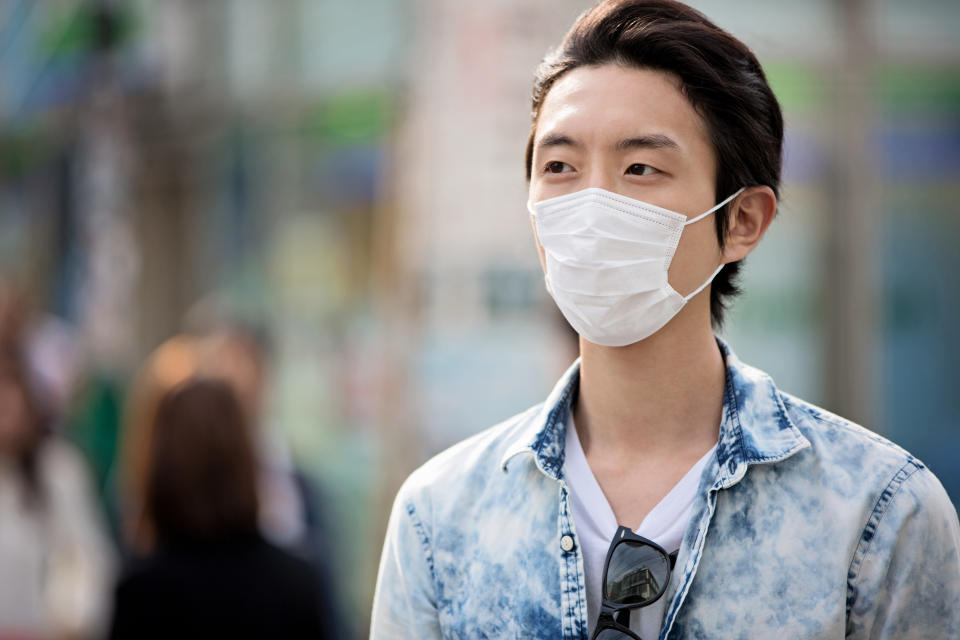 Japanese man wearing protective mask in Tokyo.