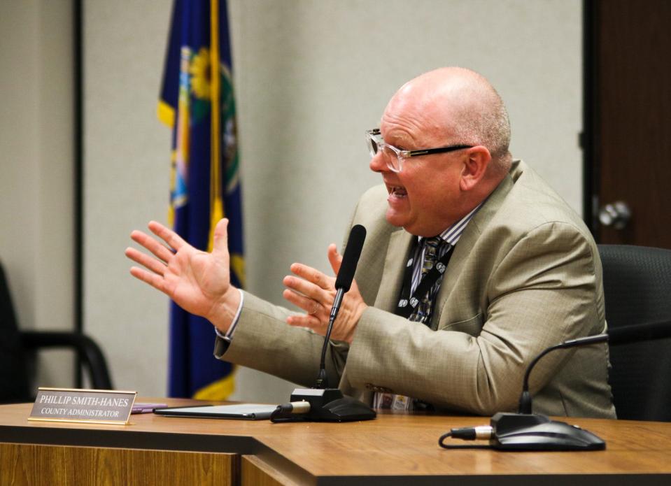 Saline County Administrator Phillip Smith Hanes explains a state statute to the board of commissioners April 4.