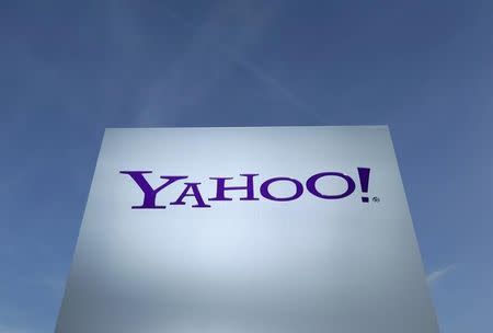 A Yahoo logo is pictured in front of a building in Rolle, 30 km (19 miles) east of Geneva, in this file picture taken December 12, 2012. REUTERS/Denis Balibouse/Files