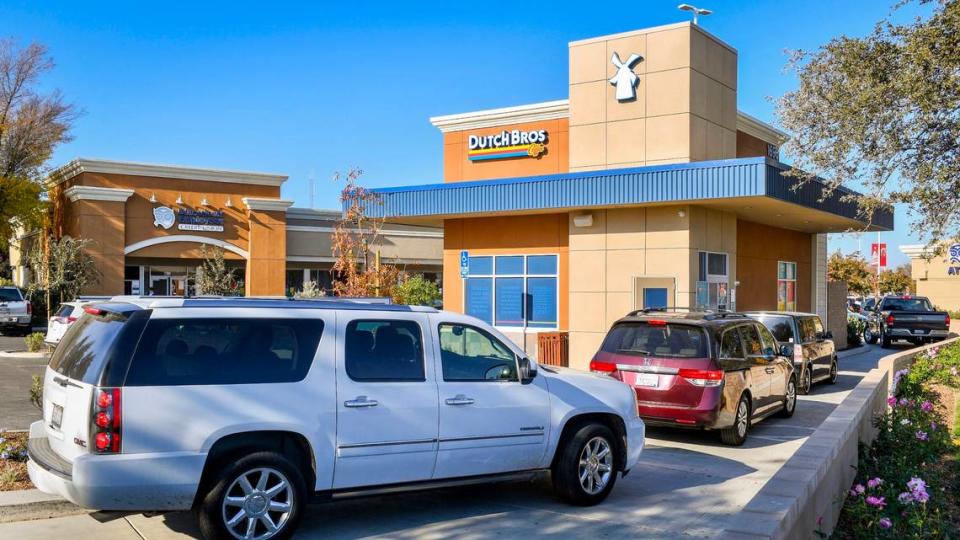 A Dutch Bros. Coffee restaurant has a colorful exterior and atmosphere.