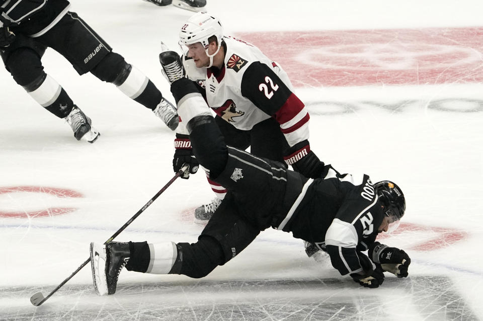 Arizona Coyotes left wing Johan Larsson, left, and Los Angeles Kings left wing Andreas Athanasiou collide during the first period of an NHL hockey game Wednesday, March 3, 2021, in Los Angeles. (AP Photo/Mark J. Terrill)