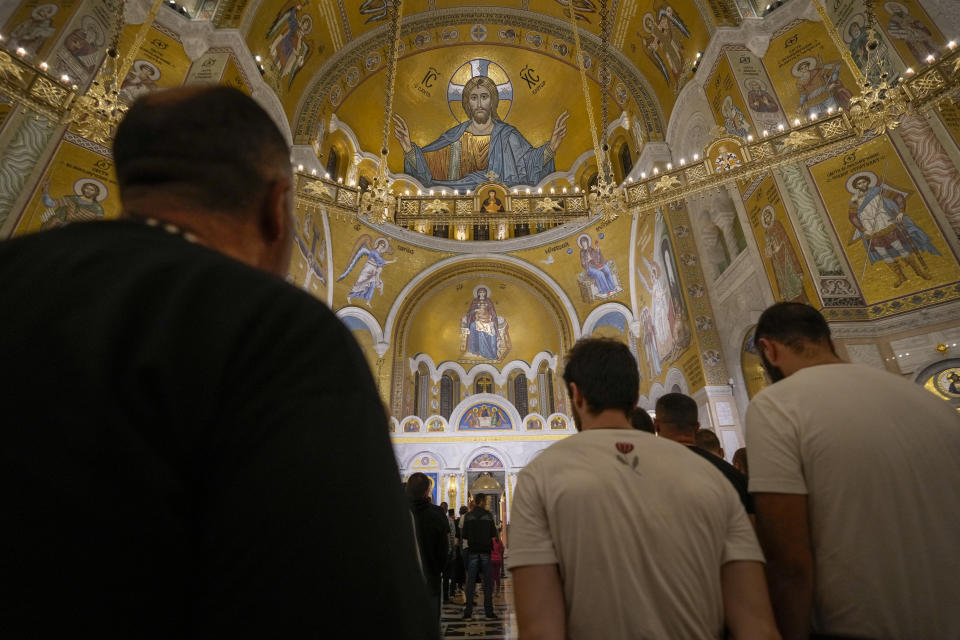 Red Star soccer fans attend the liturgy for the three killed Serbs, in the St. Sava Serbian Orthodox temple in Belgrade, Serbia, Wednesday, Sept. 27, 2023. In one of the worst confrontations since Kosovo declared independence from Serbia in 2008, about 30 masked men opened fire on a police patrol near the village of Banjska early Sunday then broke down the gates of a Serbian Orthodox monastery and barricaded themselves with the priests and visiting pilgrims. (AP Photo/Darko Vojinovic)