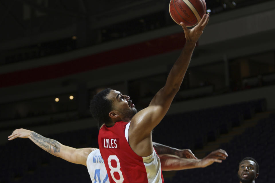 Canada's Trey Lyles drives to the net during the first half of a FIBA men's Olympic qualifying basketball game against Greece Tuesday, June 29, 2021 at Memorial Arena in Victoria, British Columbia. (Chad Hipolito/The Canadian Press via AP)