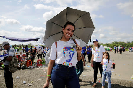 A supporter of Bolivia's President Evo Morales poses as she attends a rally in Chimore in the Chapare region, Bolivia, May 18, 2019. REUTERS/David Mercado