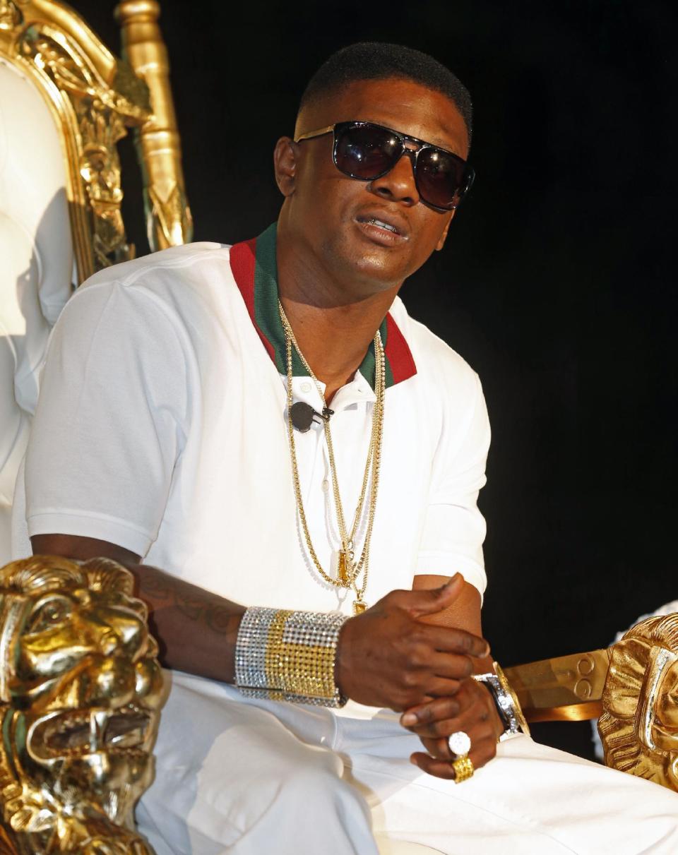 Rapper Lil Boosie, whose real name is Torence Hatch, appears at a news conference in New Orleans, Monday, March 10, 2014. Hatch was released from Louisiana State Penitentiary at Angola where he had been serving an eight-year sentence on drug charges. Lil Boosie says serving prison time in a Louisiana prison was life changing and it's made him a better person and ultimately, he hopes, a better artist. He says he wrote more than 1,000 songs in prison. (AP Photo/Bill Haber)