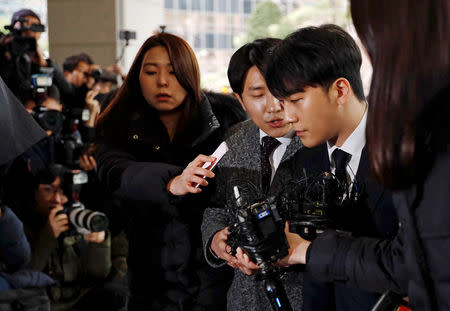 Seungri, a member of South Korean K-pop band Big Bang, arrives to be questioned over a sex bribery case at the Seoul Metropolitan Police Agency in Seoul, South Korea, March 14, 2019. REUTERS/Kim Hong-Ji