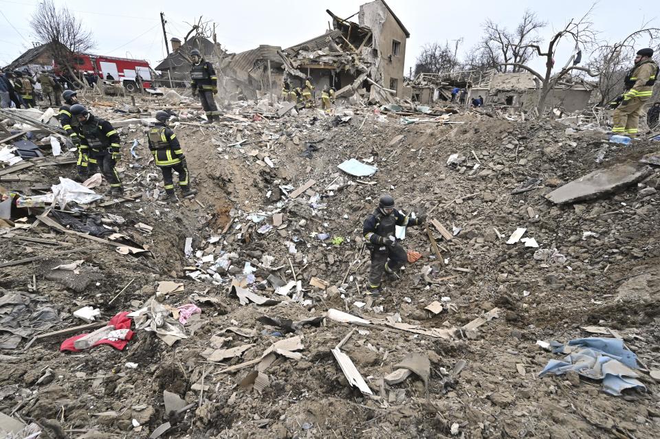Rescuers are searching among the debris of houses destroyed by a massive missile strike by Russian troops in Zaporizhzhia, Ukraine, on March 22, 2024.