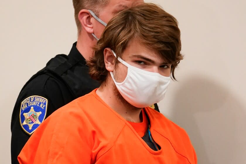 Payton Gendron is led into the courtroom for a hearing at Erie County Court, in Buffalo, N.Y., Thursday, May 19, 2022. Gendron faces charges in the May 14, fatal shooting at a supermarket. (AP Photo/Matt Rourke)