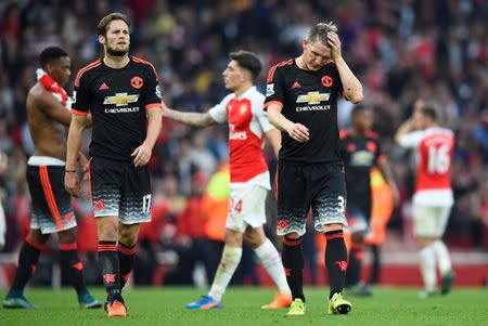 Football - Arsenal v Manchester United - Barclays Premier League - Emirates Stadium - 4/10/15 Manchester United's Bastian Schweinsteiger and Daley Blind look dejected at the end of the match Reuters / Dylan Martinez