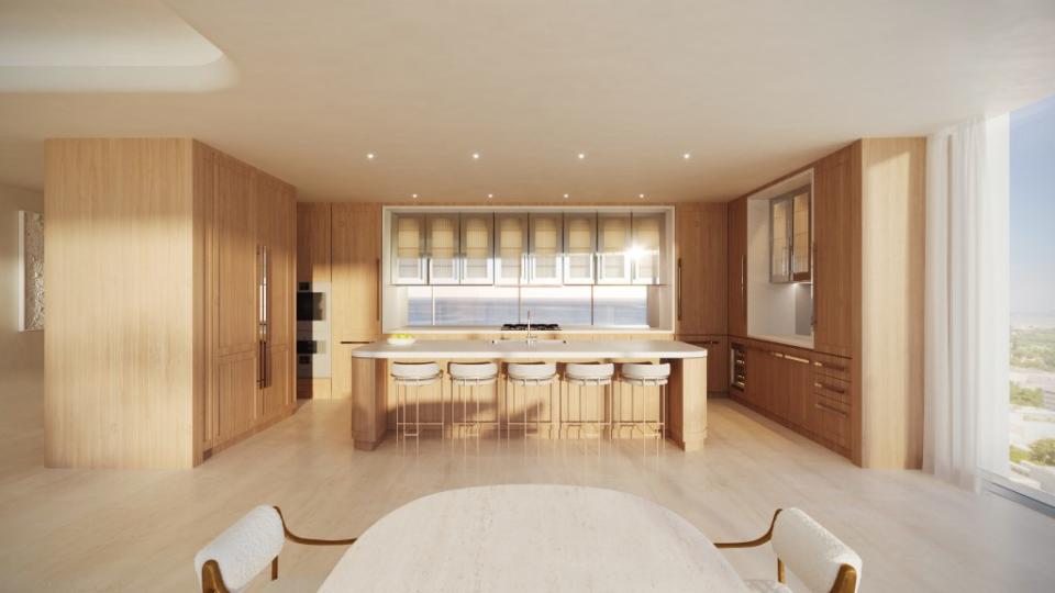 The sleek kitchen with an expansive island. The Boundary