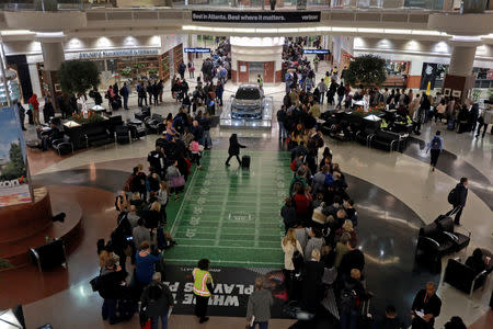 Lines of passengers waiting to pass through the main Transportation Security Administration (TSA) security checkpoint are seen at Hartsfield-Jackson Atlanta International Airport amid the partial federal government shutdown, in Atlanta, Georgia, U.S., January 18, 2019. REUTERS/Elijah Nouvelage