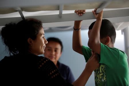 A migrant from El Salvador interacts with her son at the Senda de Vida migrant shelter in Reynosa, in Tamaulipas state, Mexico June 22, 2018. Picture taken June 22, 2018. REUTERS/Daniel Becerril