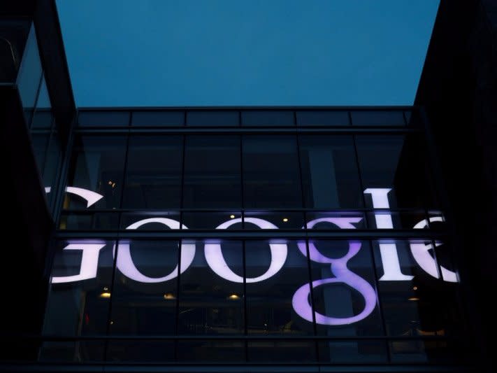 The sign marking the Google offices is lit up in Cambridge, Massachusetts, U.S., June 27, 2017.   REUTERS/Brian Snyder