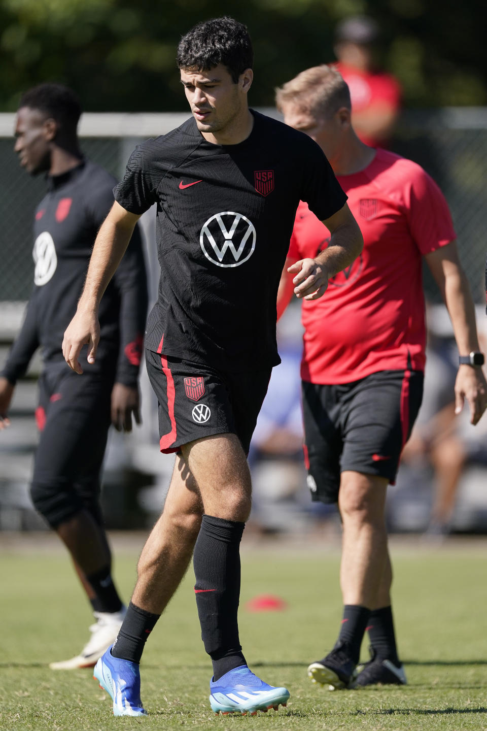 United States midfielder Gio Reyna moves across the field during a soccer training session Tuesday, Oct. 10, 2023, in Brentwood, Tenn. (AP Photo/George Walker IV)