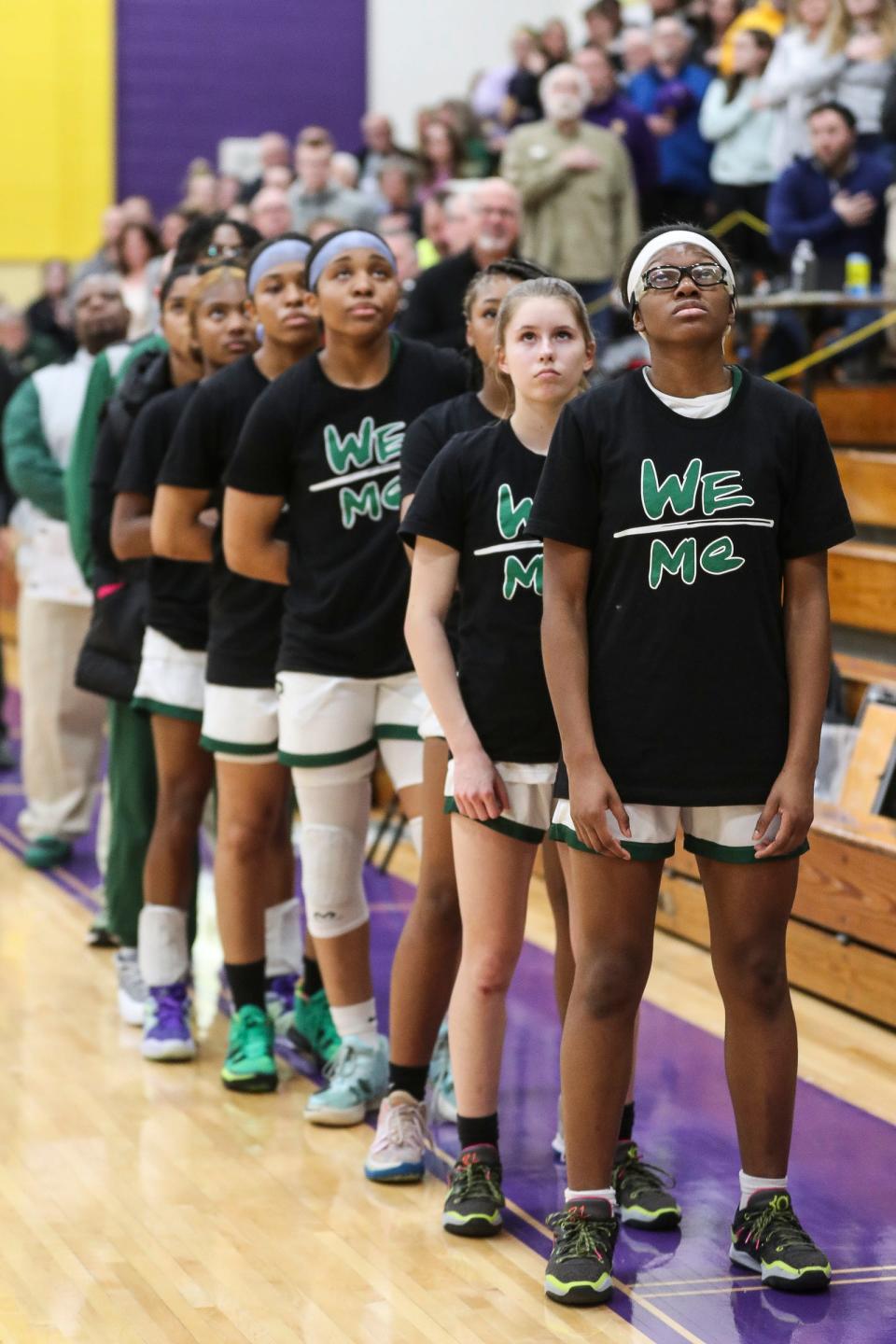 Ypsilanti Arbor Prep players and coaches line up for national anthem before the 50-42 win over Brooklyn Columbia Central in the MHSAA Division 3 regional semifinal at Concord High School on Tuesday, March 7, 2023.