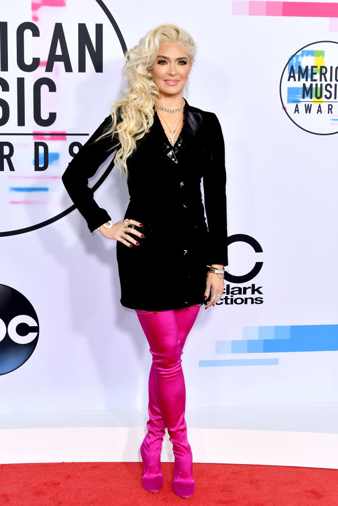 Erika Girardi rocking neon pink boots and a black blazer