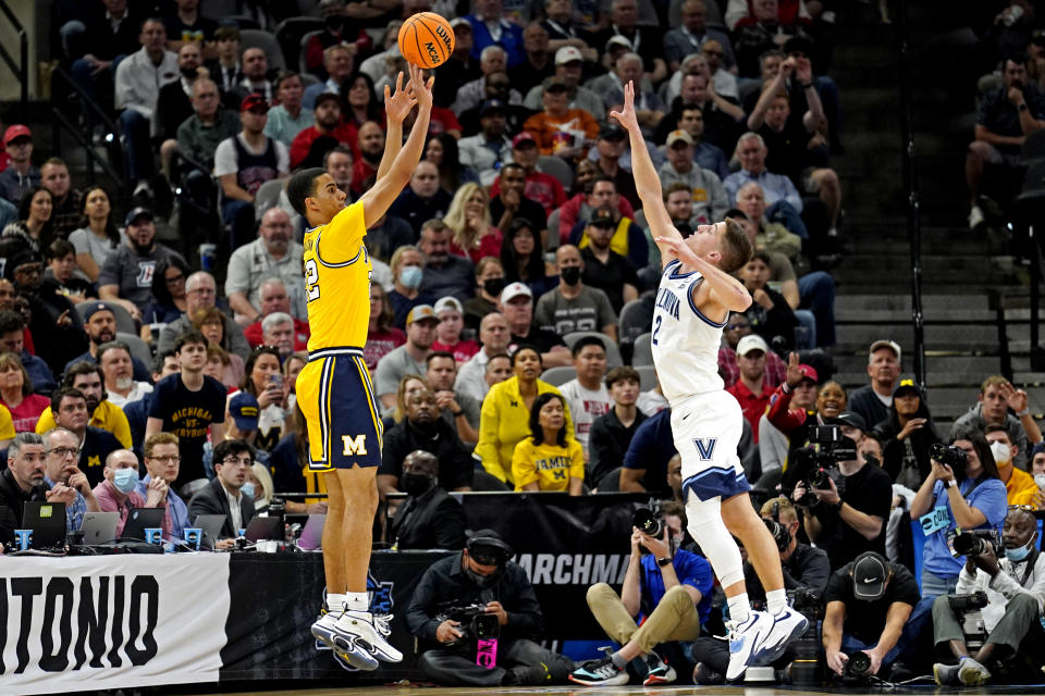 Michigan forward Caleb Houstan shoots against Villanova guard Collin Gillespie during the NCAA men's tournament on March 24, 2022. (Scott Wachter/USA TODAY Sports)