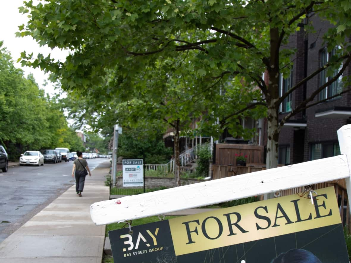 Homes for sale in the Spadina-Fort York area in Toronto are pictured on June 1, 2022. The volume of Canadian home sales declined by 5.3 per cent on a month-over-month basis in July, marking the smallest decline since housing activity slowed five months ago, according to the Canadian Real Estate Association.  (Esteban Cuevas/CBC - image credit)