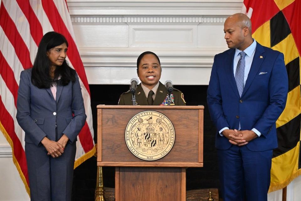 Brig. Gen. Janeen Birckhead, surrounded by Maryland Lt. Gov. Aruna Miller, left, and Gov. Wes Moore, right, speaks at the announcement naming her Maryland's new adjutant general on Wednesday, April 5, 2023.