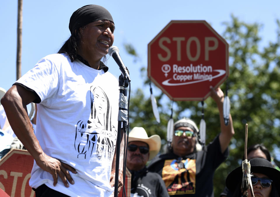 FILE - In this July 22, 2015 file photo, Tribal councilman Wendsler Nosie Sr. speaks with Apache activists in a rally to save Oak Flat, land near Superior, Ariz., sacred to Western Apache tribes, in front of the U.S. Capitol in Washington. Nosie is drawn to a mountainous area in central Arizona where he and other Apaches have harvested medicinal plants, held coming-of-age ceremonies and gathered acorns for generations. On Thursday, Nov. 28, 2019, he'll start a three-day journey to make a permanent home at Chi’chil Bildagoteel, or Oak Flat, in protest of a copper mine made possible by a federal land exchange. (AP Photo/Molly Riley, File)