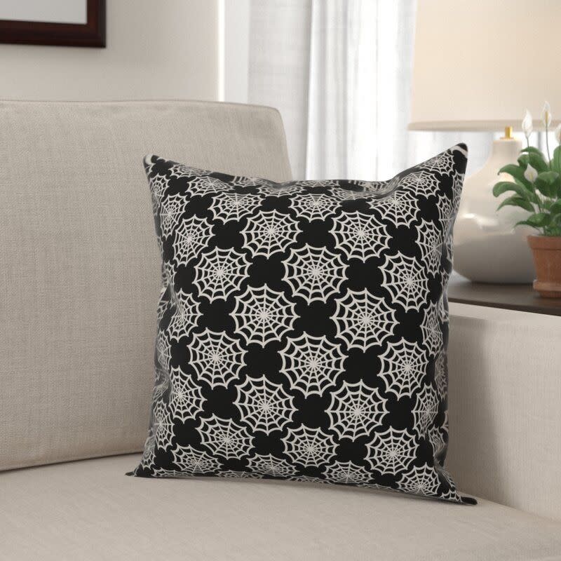 4) The Holiday Aisle Hetherington Spiderweb Throw Pillow