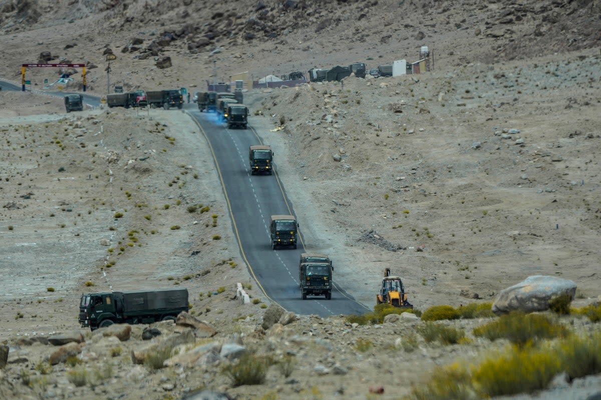 Indian army vehicles move in a convoy in the cold desert region of Ladakh, India on Tuesday  (AP)