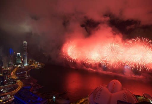 Fireworks explode over Victoria Harbour. Hong Kong's biggest protest for nearly a decade packed the former British colony's streets Sunday in a defiant reception for its new leader and a show of popular anger after 15 years of Chinese rule