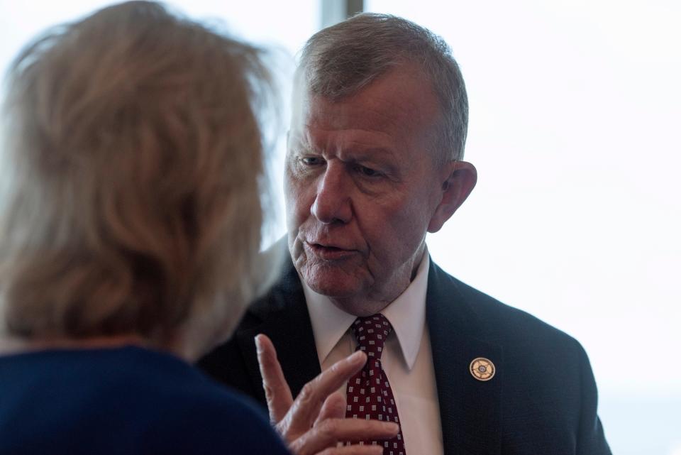 Jackson County Sheriff Mike Ezell, who is running for Congress, talks to a supporter during a campaign press conference at the Great Southern Club in Gulfport on June 9, 2022.