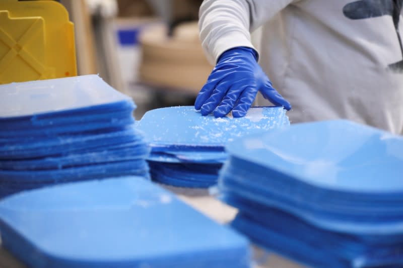 Workers at Bednark produce medical face shields, as the demand for their production rapidly increased